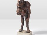 statue of a man holding a baby in his arms