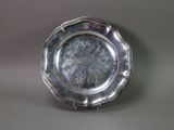 a silver plate that is sitting on a table