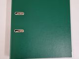 a green binder sitting on top of a white table