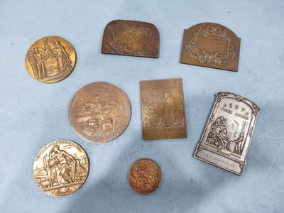 some of the coins are sitting on a blue surface