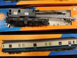three toy trains sitting on a table next to each other