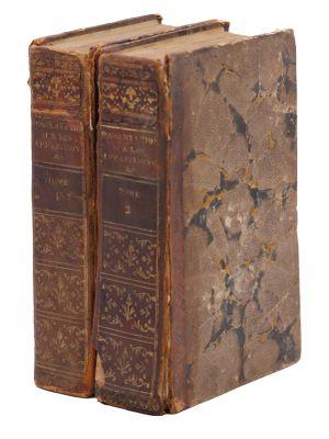 two old books that are sitting on top of each other
