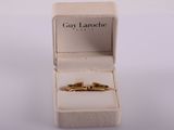 an image of a couple of gold rings in a white box