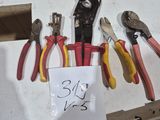 many different types of pliers on the table
