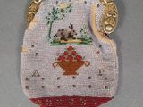 a small purse that has a picture of a dog on it