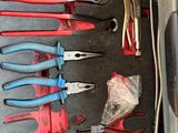 many different types of pliers in a box