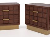 two wooden nightstands with brass pulls on each of them