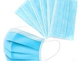 blue disposable surgical face masks on a white background