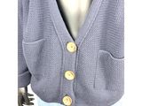 a close up of a mannequin mannequin wearing a sweater and jeans