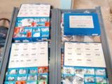 two open boxes of assorted items on a table