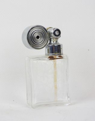 a small glass bottle with a lighter inside of it