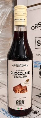 a bottle of chocolate syrup next to a box of chocolate