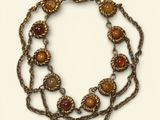 an image of a close up of a necklace on a white background
