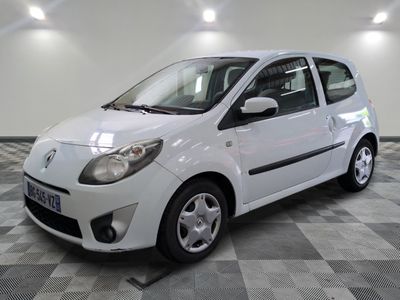 a picture of a small white car parked in a garage