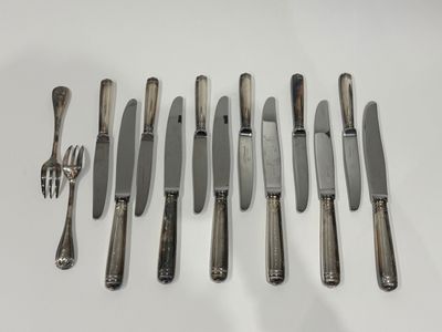 an assortment of silverware including knives, forks and spoons