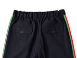 a close up of a black shorts with a red, green, and yellow stripe on the side