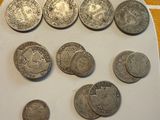 a lot of coins sitting on a plate on a table