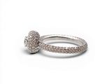 a close up of a diamond ring on a white background