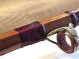 a close up of a wooden stick with a ring on it