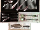 silverware in a box with spoons, knives, and spoons in it
