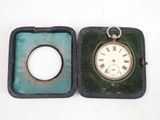 a small box with a clock inside of it