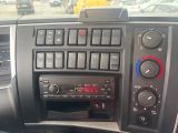 a radio in the dash of a car with buttons on it