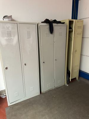 three lockers in a room with one open and the other closed