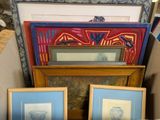 two framed pictures of vases and a vase on a table