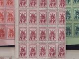 four different postages with different designs on them on a table