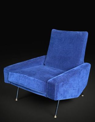 a blue chair on a black background with a black background
