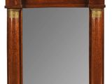 image d'un miroir avec un cadre en bois sur fond blanc