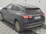 the back of a mercedes suv parked in a garage