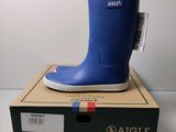 an image of a pair of blue rain boots sitting on top of a box