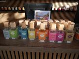 many different types of soaps on the counter