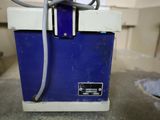 a blue and white cooler sitting on a counter