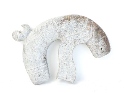 a small elephant statue on a white surface