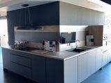 a kitchen with a large island in the middle of the room