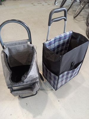two bags that are next to each other on the floor