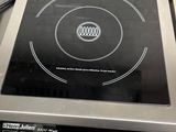 an image of a stove top with a digital display on it