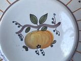 a plate with a design on it sitting on a table