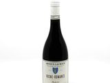 a bottle of wine that is sitting on a table