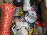 a box full of yarn, scissors, scissors, and other items