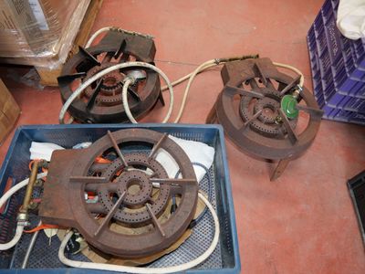 a blue box with a fan and some wires on the floor
