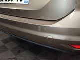 a close up of a car ' s rear end with a number plate on it