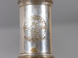a close up of a silver object on a table