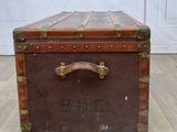 an old suitcase sitting on the floor in a room