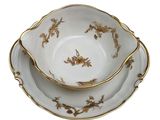 a close up of a plate and bowl on a white surface