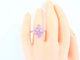 an image of a woman ' s hand with a ring on it ' s finger