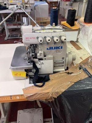 a sewing machine that is sitting on a table in a room