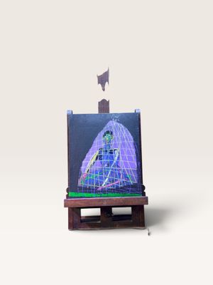 une maquette miniature d'un vaisseau spatial posée sur un petit chevalet